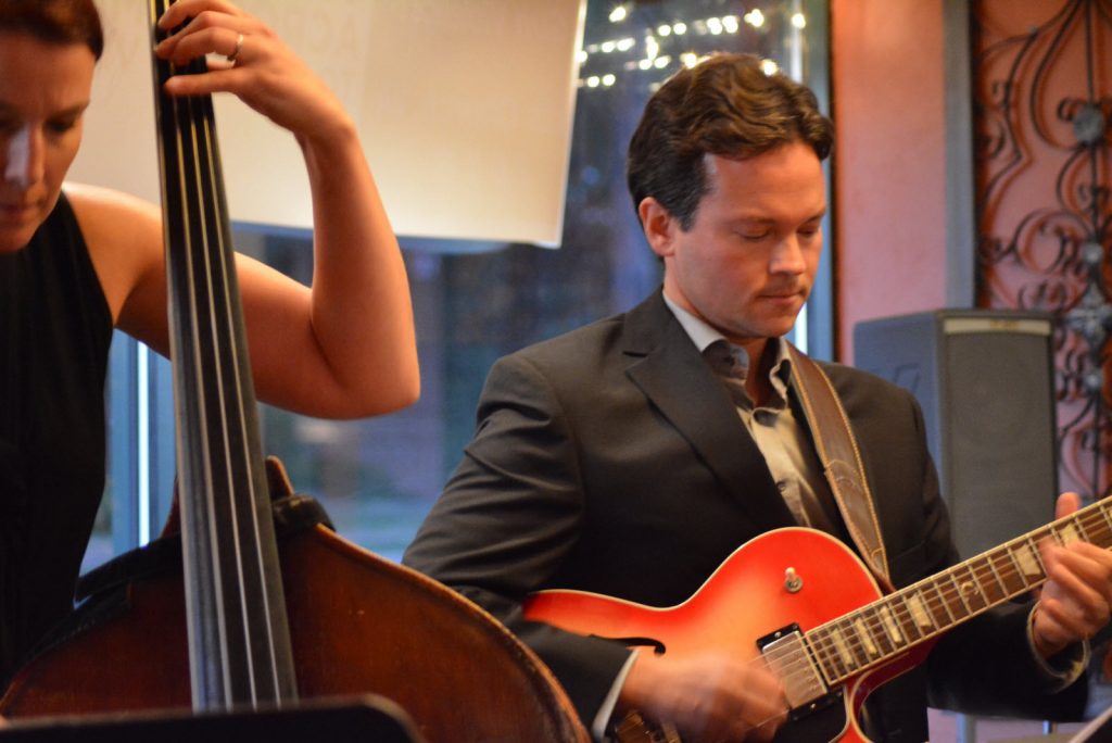 Josh Walker plays on the guitar, beside his wife on the bass. (Photo courtesy of Carol Sly)