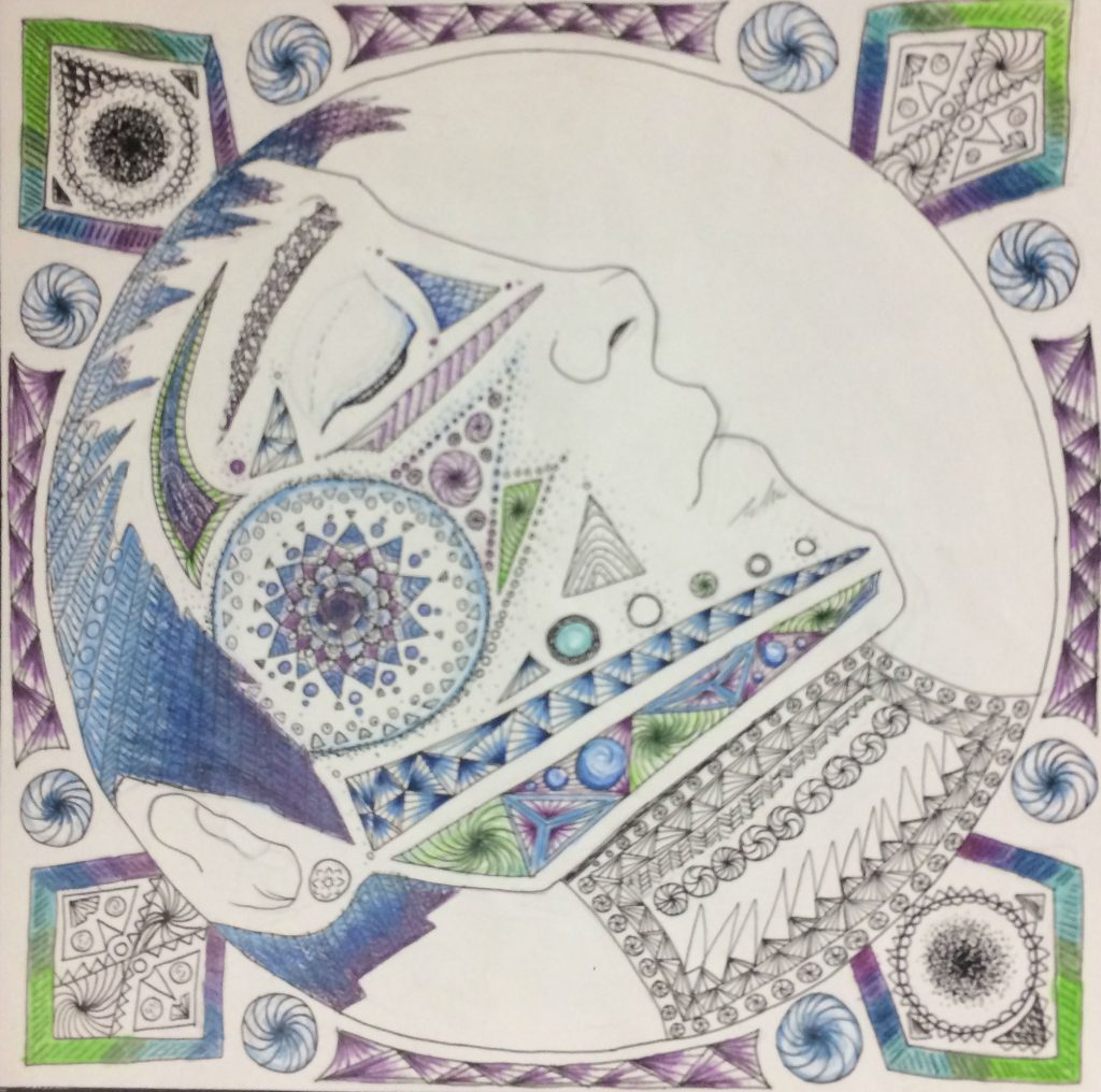 Sophomore Mia Nave uses a cool color scheme for the detailed designs and shapes on her drawing of a face (Photo Credit: Erin Dean).