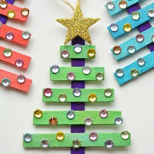 Christmas trees made out of colored popsicle sticks