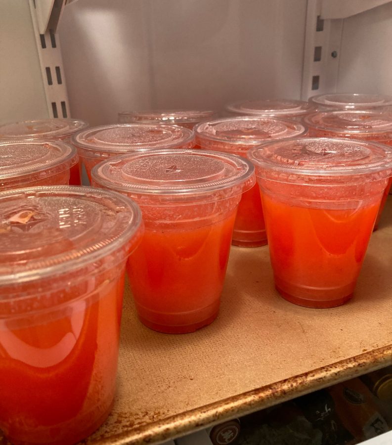 Delicious strawberry lemonade sits in a cooler.