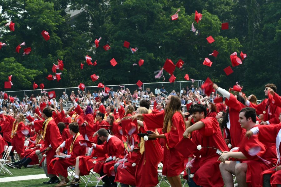 The Class of 2023 graduates throw their caps up to the sky in celebration. (Photo courtesy of FCCPS Photo/Carol Sly)