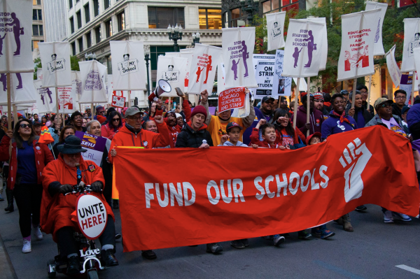 Members of the Chicago Teachers’ Union picket while on strike for better compensation and school services in October of 2019 after their old contract expired. (Photo via Wikimedia Commons)