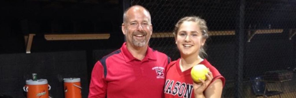 Student posing with softball coach