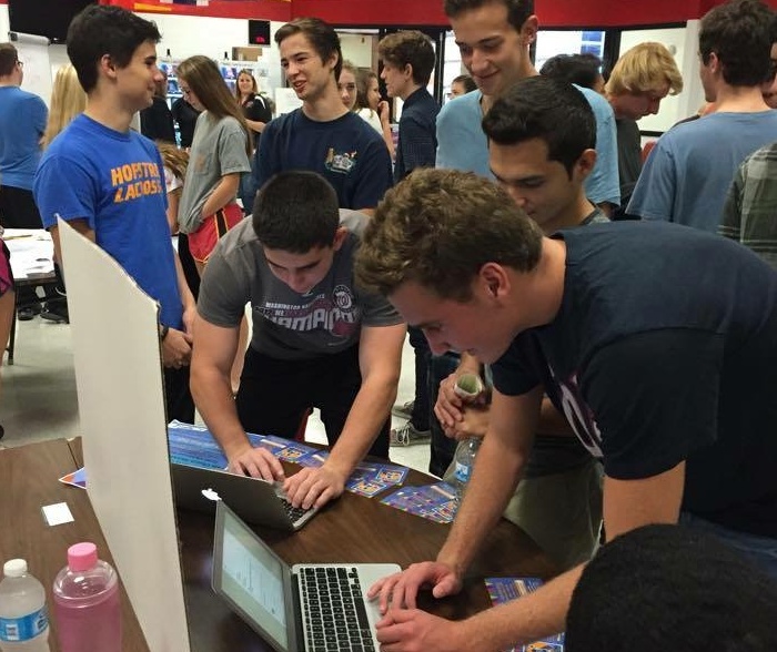 Students signing up for activities at the service fair