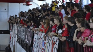 All the students peer down over the gym from the bleachers