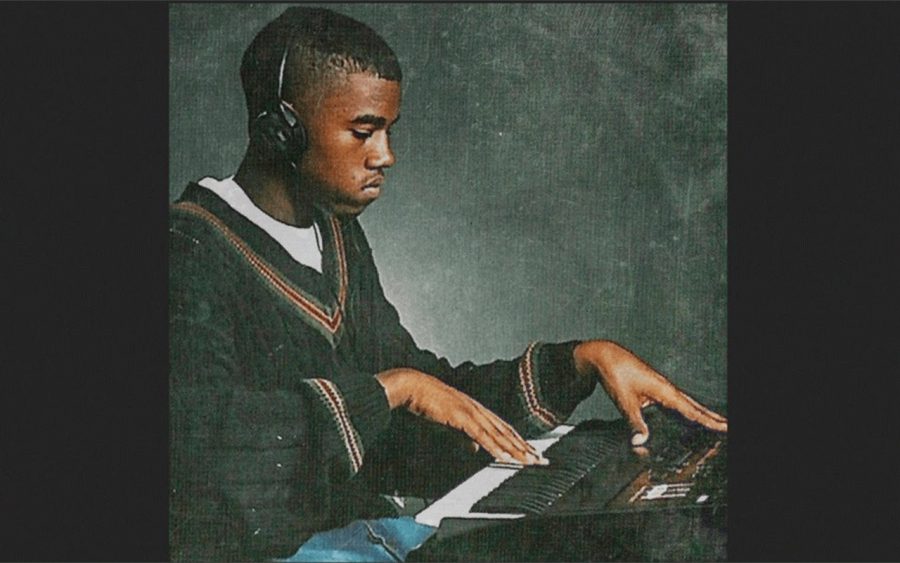 Rapper and producer Kanye West putting together a beat on a keyboard.