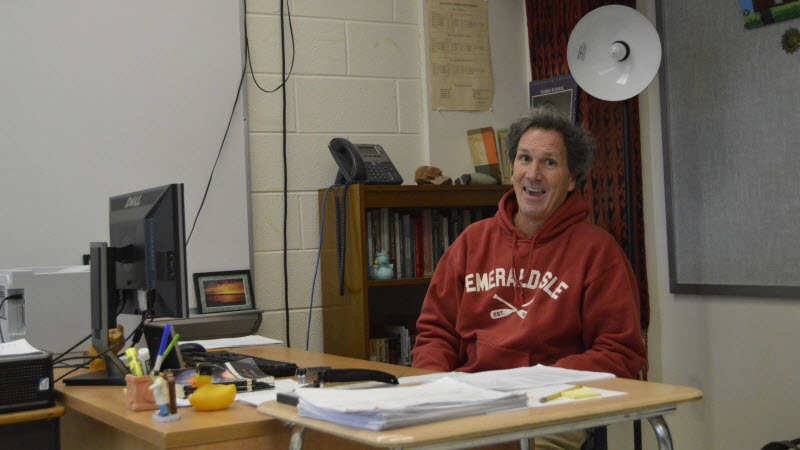 English teacher Brian Walsh laughs at a conversation he has with a colleague. (Photo by Liam Bridge)