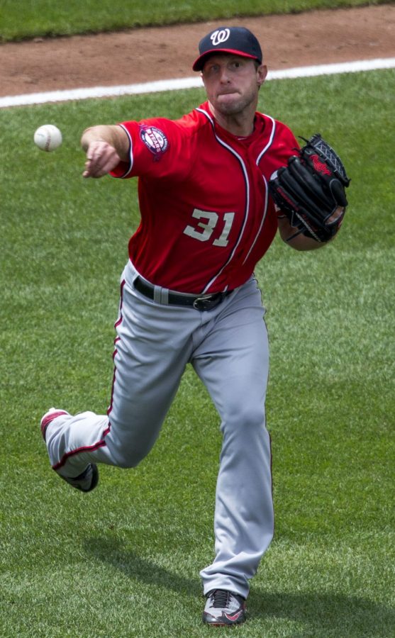 MLB player Max Scherzer throwing a pitch.