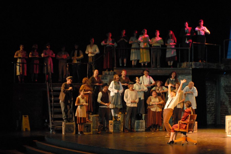 A group performing Urinetown.