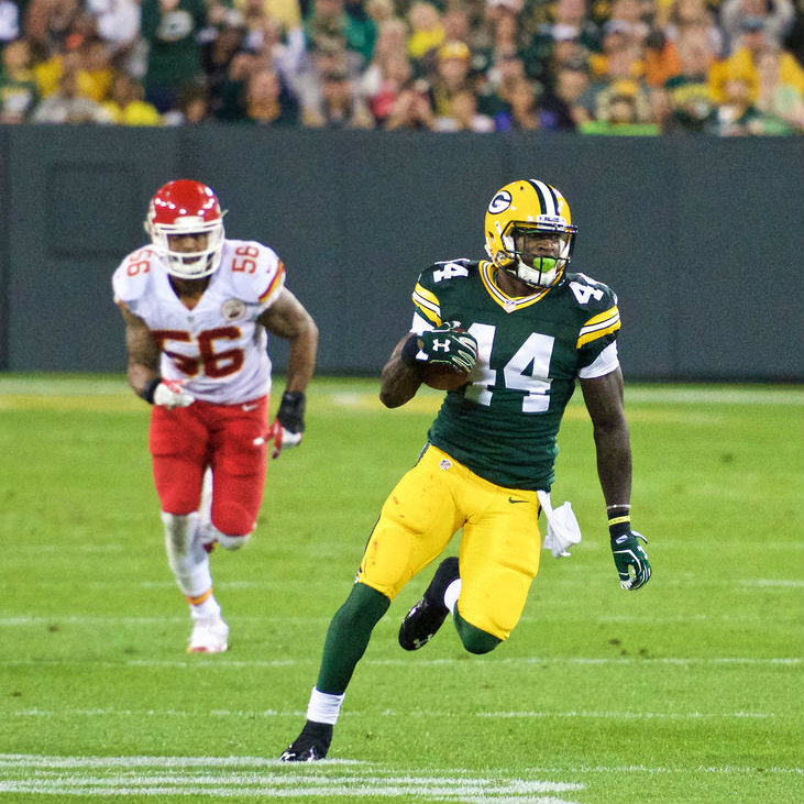 NFL player James Starks running with the ball.