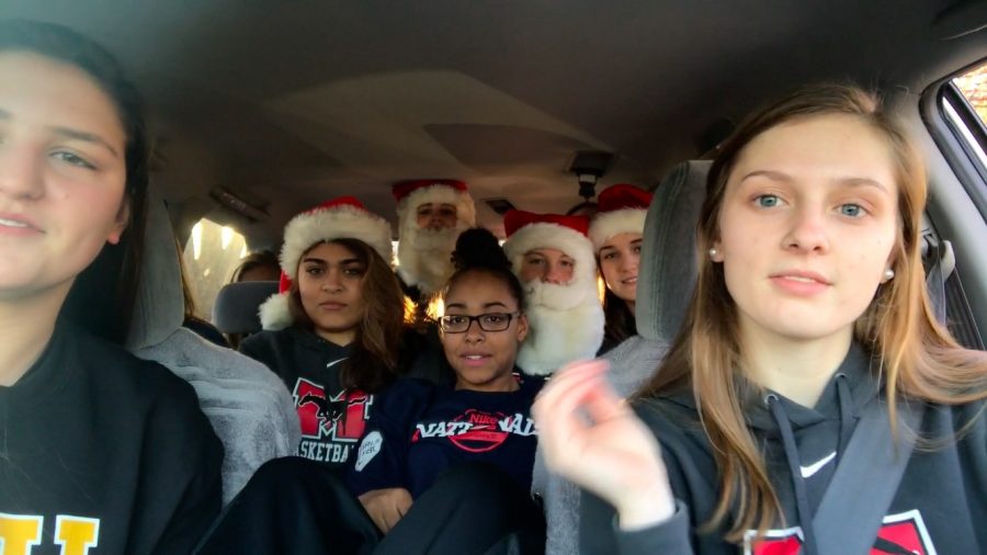 Juniors Kaylee Hirsch, Lizzie Dodge, and other members of the girls varsity basketball team sing in this edition of Mason Carpool Karaoke. Photo courtesy of Nicole Bloomgarden.