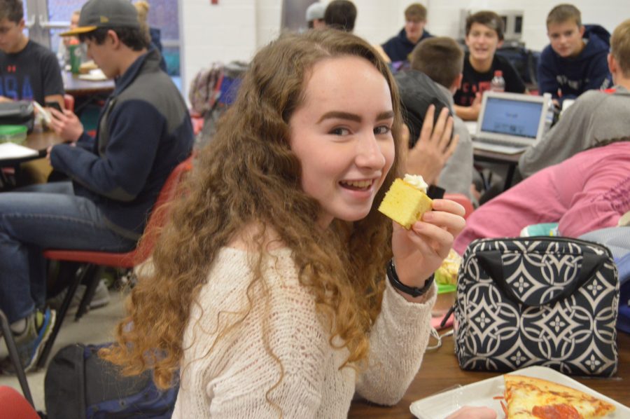 Student eats cake in the cafeteria