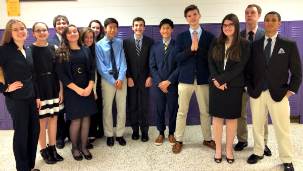 Debate team lines up for photo