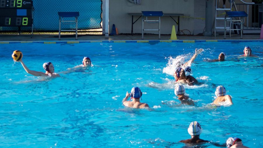 Sophomore Ryan Fry about to pass the ball during a water polo match