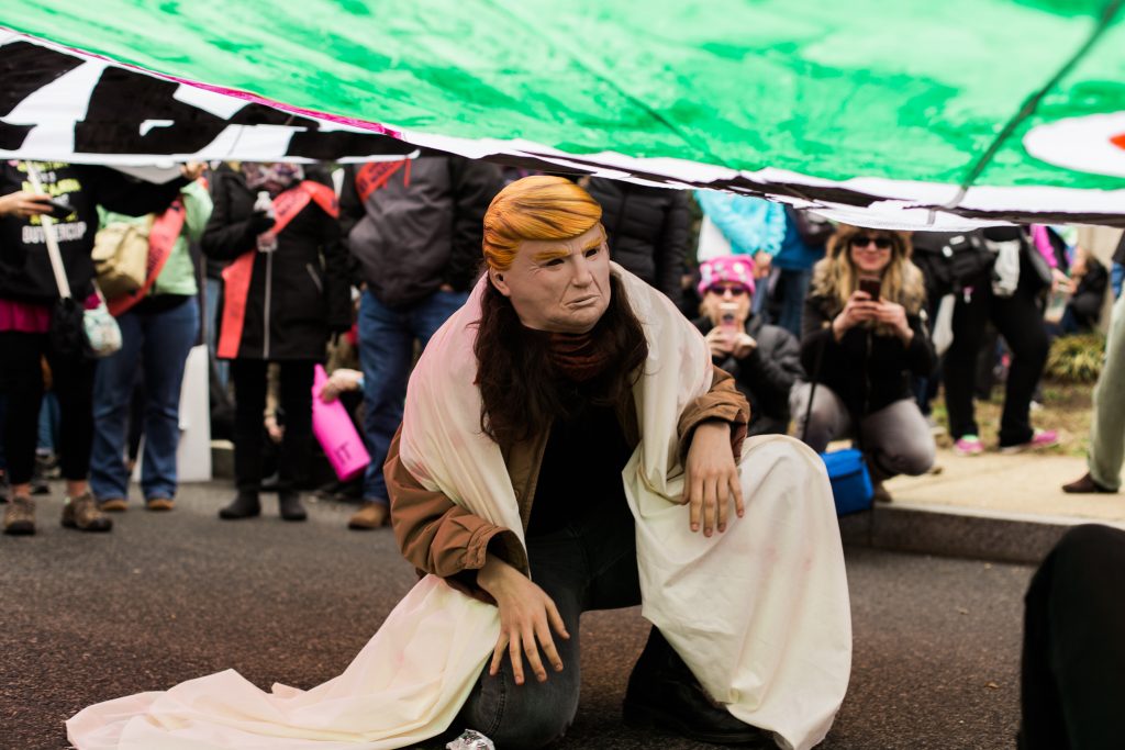 A protester with a Trump mask danced under a large “freedom tent” at the rally. Out of the many eventful parts of the day, this was definitely a highlight. (Photo by Viraj Suri)