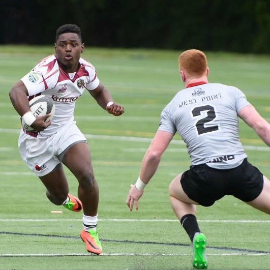 DMontae Noble runs during a college rugby game