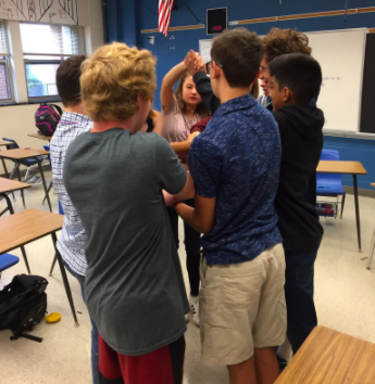 A group of students playing the human knot.