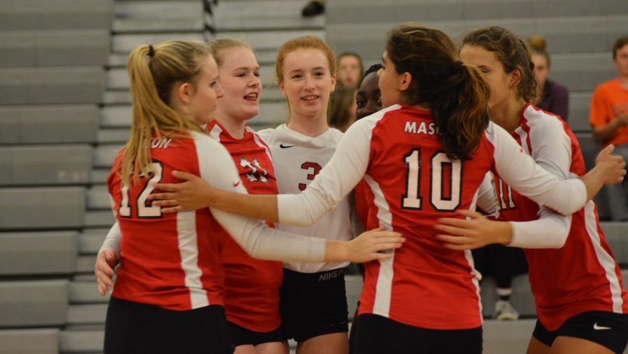 Volleyball girls celebrating a point