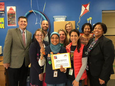 Hausa Rahman (center), a teacher of Thomas Jefferson Elementary School receives balloons and recognition for her grant proposal for a music therapy program for life skills students at FCCPS.  (Photo via FCCPS Communications)