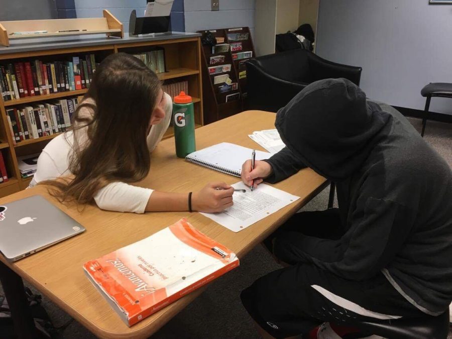 Senior Laura Whitaker tutoring a student during Saturday Learning Lounge. This tutoring club is open every Saturday from 9-12 p.m.. Students can sign up through the GM website. (Photo courtesy of Bhaskar Singhvi).