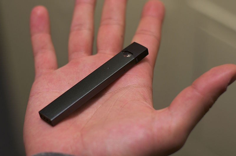 These new e-cigarettes are growing in popularity in high schools across the country. Many schools have take steps to band the use and possession of Juuls on school campuses. (Photo courtesy of Mylesclark96 via Wiki Commons)