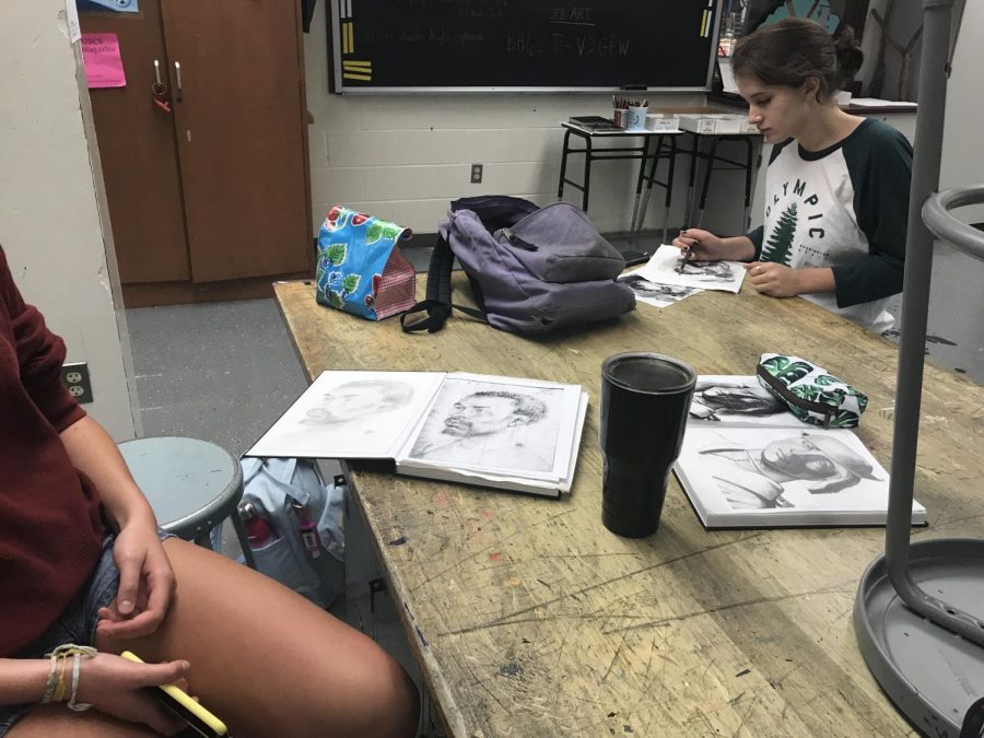 Art students work on portraits