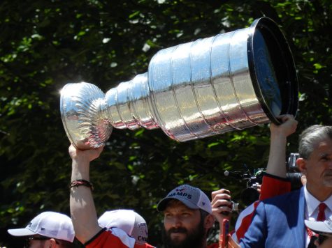Alex Ovechkin raises the Stanley Cup.