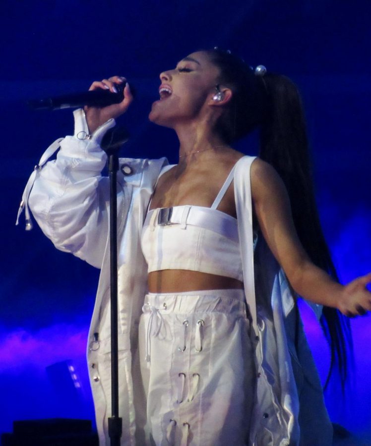 ariana grande sings on stage