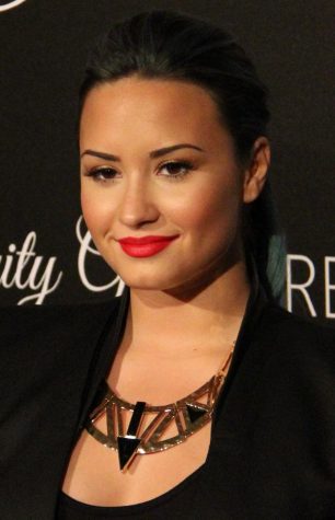 Singer Demi Lovato smiles for a photo. 