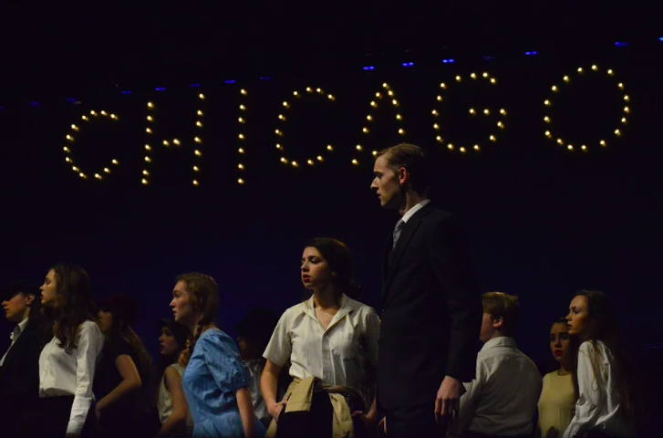 Seniors Shannon Rodgers and Miles Jackson stand on stage in their performance of Chicago