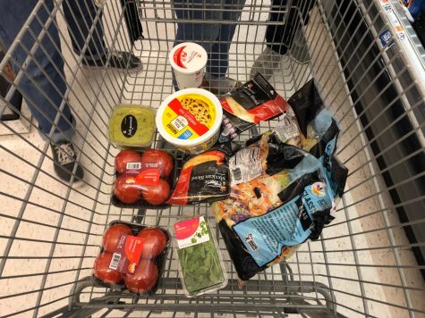 A grocery cart full of ingredients.