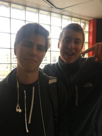 Two students pose with each other.