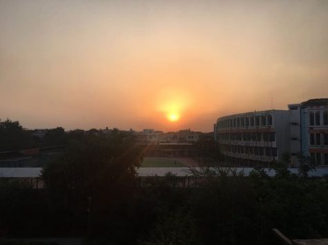 The sun rises over New Delhi.