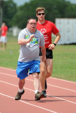 two people speed walking on a track