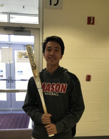 Player poses with bat