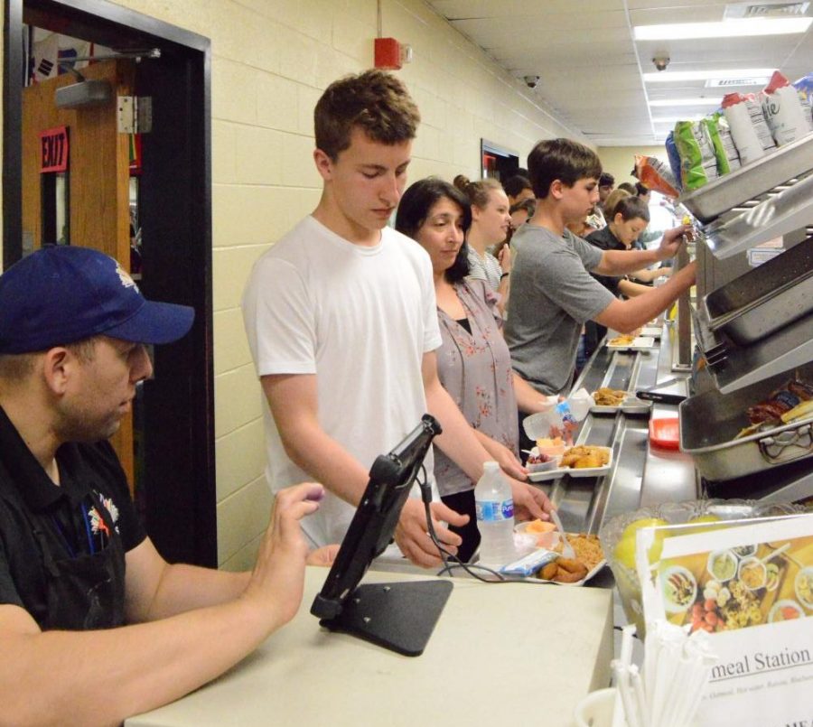 Students wait to pay for lunch