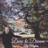 Picture of Meghan with her arms out amongst many leaves and "Dare to Dream" written in white cursive along the bottom.