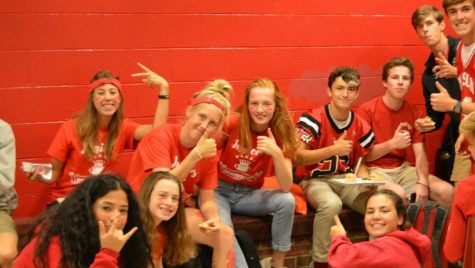 Several Juniors sit in the bright red alcove.