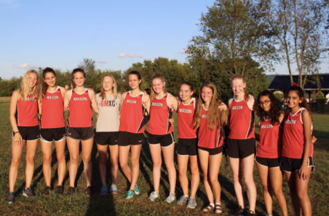 cross country team poses for a photo