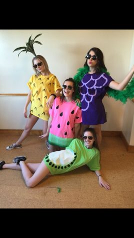 Girls dressed as a pineapple, watermelon, grapes, and an avocado.