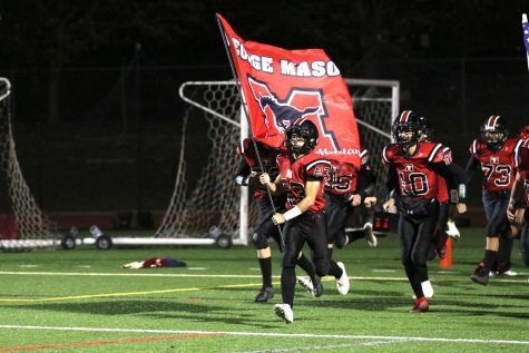 Football player running with flag.