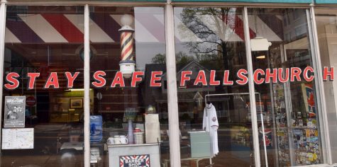 The Neighborhood Barbershop spells out "Stay safe Falls Church" in their window