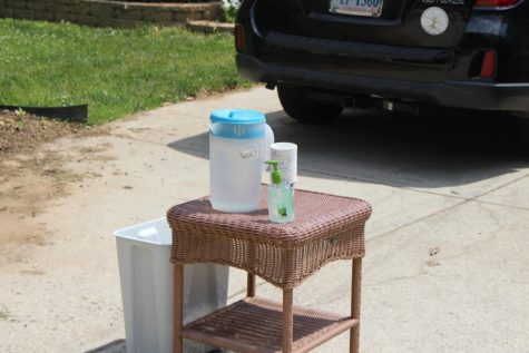 table in driveway with water