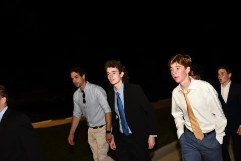 Students walk towards the homecoming dance.