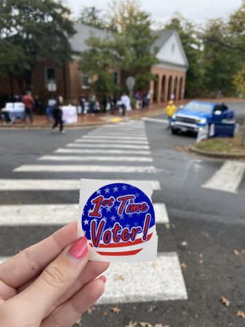 picture of first time voter sticker outside of voting ward