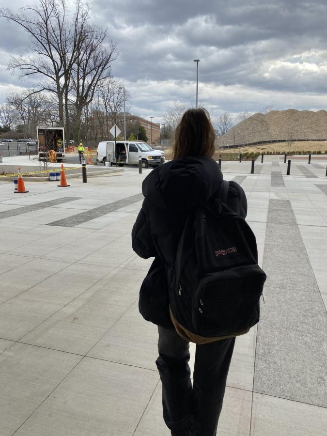 Girl walks out of Meridian High School Building