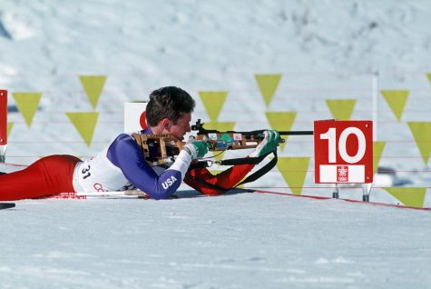 An Olympian participates in biathlon.