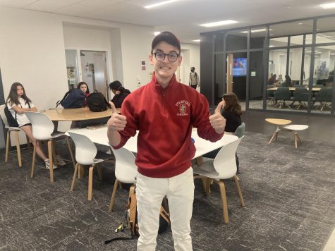 Hunter Hicks gives two thumbs up in his Stanford pullover.