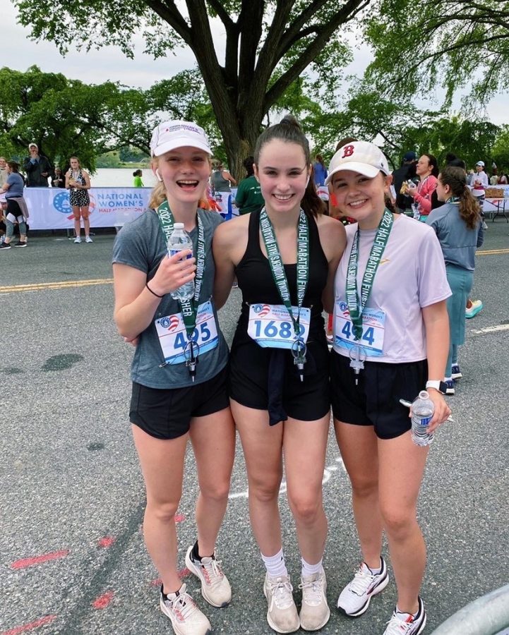 Chloe Calabrese, Erin Tarpgaard, and Katie Rice smiling with their medals after they finished the race. (Photo courtesy of Erin Tarpgaard)