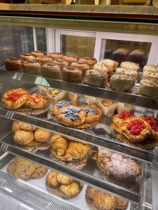 Racks of baked goods behind a glass panel at Godfrey’s Bakery Cafe. (Photo courtesy of Tatiana McKenzie)

